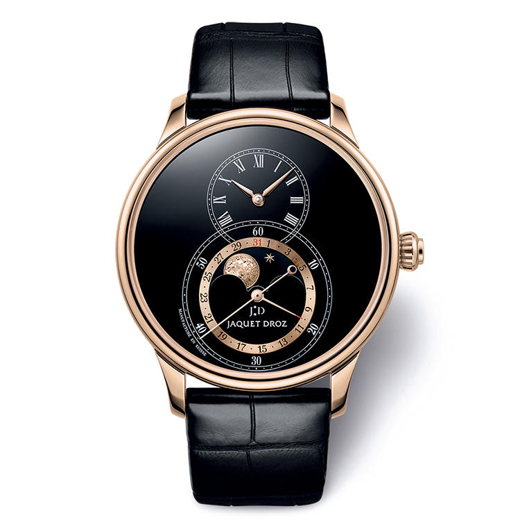 <span style=background-color:#000;color:#fff;padding:10px;>漆黒の闇に輝くゴールドムーン</span><br /><br /><font size=4><b>JAQUET DROZ</b></font><br />ジャケ・ドロー<br /><font color=red><b>グラン・セコンド ムーン ブラックエナメル</b></font><br />艶やかな黒エナメル文字盤下部にブラックオニキス製ムーンディスクを置き、そこに18Kレッドゴールドの星と22Kの月の彫金細工を配した。エナメルや彫金で実力を発揮するジャケ・ドローならではの芸術的ムーンフェイズだ。自動巻き。径43mm。18Kレッドゴールドケース。アリゲーターストラップ。314万円（ジャケ・ドロー ブティック銀座）