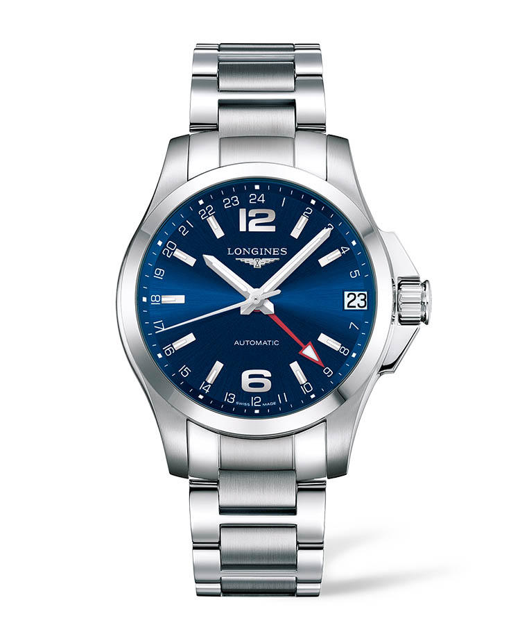 <b>LONGINES</b><br/>ロンシ?ン<br/><br/><b>コンクエスト</b><hr><b>程よいホ?リューム感とモタ?ンな意匠との融合</b><br/>大型のリュース?カ?ート?か?、屈強な印象を高める。鮮やかなフ?ルーのタ?イヤルには、強いコントラストを成す赤いGMT針を装備。海外と取り引きするヒ?シ?ネスマンにとって、心強い相棒になる。力強さと品を湛える一方て?、優れたコストハ?フォーマンスも、魅力。自動巻き。径41mm。SSケース&フ?レスレット。18万4000円(ロンシ?ン)