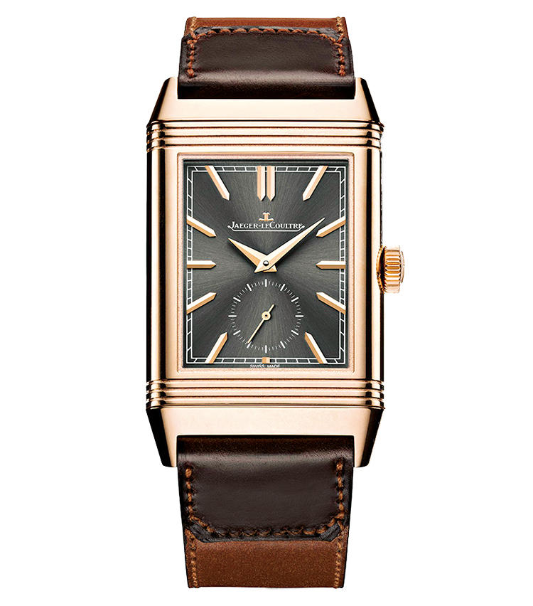 ■<b>JAEGER-LECOULTRE</b><br>ジャガー・ルクルト レベルソ・トリビュート・デュオ<br><br><b>経年変化が楽しめる上質なレザー</b><br>艶やかなストラップは、アルゼンチンのブーツブランドのカーサ・ファリアーノ製。バイカラーの仕立てが、表と裏と異なる時刻を示す“デュオ”の機構にふさわしい。その各ダイヤル色も特別仕様に。限定100本。手巻き。49.4×29.9mm。18KPGケース。コードバンストラップ。予価265万円。今夏発売予定（ジャガー・ルクルト）