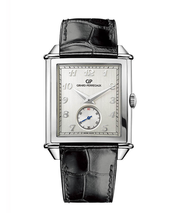 <b>GIRARD-PERREGAUX</b></br>ジラール・ペルゴ</br></br><b>ヴィンテージ1945 スモールセコンド</b><hr><b>幾何学的な角型が、柔らかな曲面をまとう</b></br>その名の通り、1945年製モデルが規範。角型ケースを縦横両方向にカーブさせ、優雅な曲線美を融和させた。ダイヤルもスモールセコンドを窪ませ、立体的に造作。縦方向にサテン仕上げしたマットなケースが、レトロな印象を増している。自動巻き。ケース36.2×35.25mm。SS ケース。アリゲーターストラップ。113万円（ソーウインドジャパン）