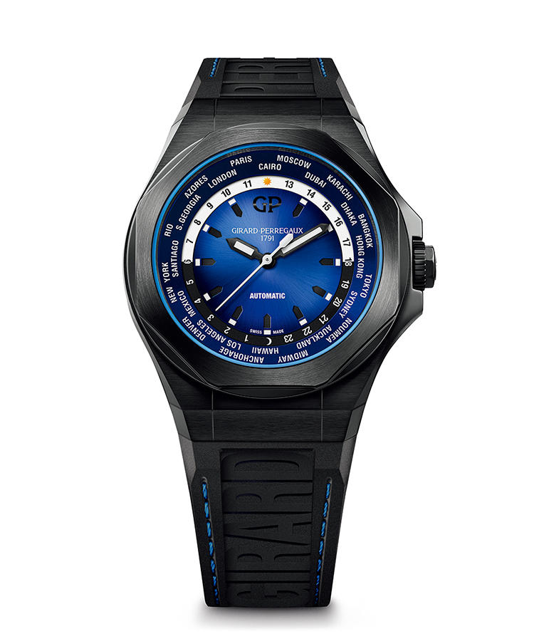 <b>GIRARD-PERREGAUX</b> ジラール・ペルゴ</br><b>ロレアート アブソルート WW.TC</b><hr style='margin-bottom:20px'><b>軽量な素材に身を包み、旅先での足取りも軽快に</b></br>ラ・ショー・ド・フォンの名門マニュファクチュールも、WW.TCの名で早くからワールドタイマーを作ってきた。その新作は、PVDで漆黒に染めたチタンのケースに身を包んだ。ケースも大型化し、防水性能も300mまで向上。軽く屈強なWW.TCは、旅のベストパートナー。ブルーのグラデーションを織り成すダイヤルの仕上げが見事。窪ませて造作したインデックスで、立体感も豊か。自動巻き。径44mm。チタンケース。ラバーストラップ。147万円(ソーウインドジャパン)