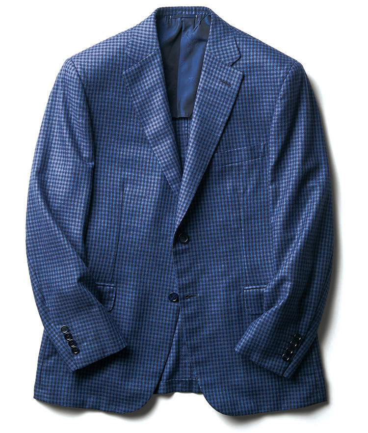 <strong>BRIONI ／ ブリオーニ</strong><br/>カシミア＋シルクは定番の掛け合わせだが、そのメリットのひとつは華やかな光沢が際立つこと。紺のシェパードチェックジャケットも、上品な艶によりエレガンスがいっそう強調されている。端正さを極めたブリオーニ流の仕立てとも抜群の相性だ。シルク51％＋カシミア49％。67万3000円（ブリオーニ ジャパン）